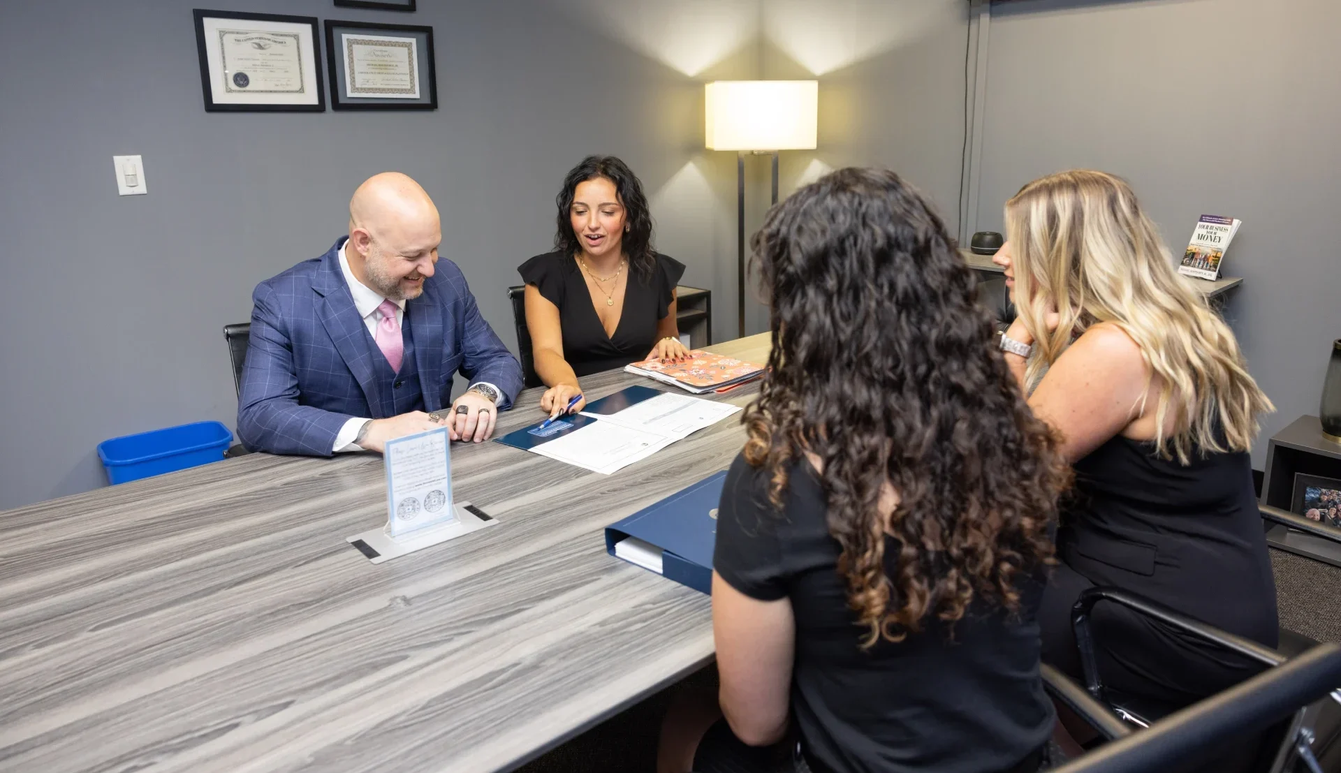 A Monteforte Law attorney meeting with clients at the conference table